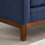 Panca imbottita con gambe in legno