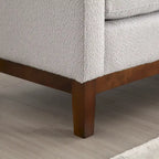 Panca imbottita con gambe in legno